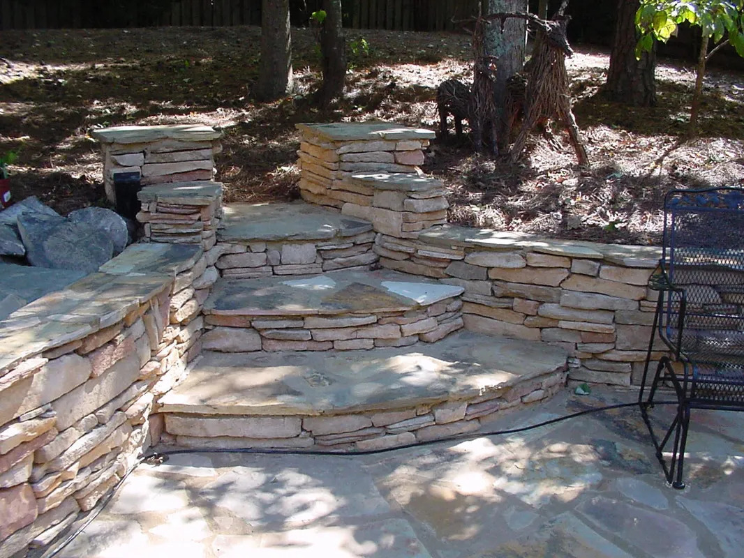Flagstone patio with curved steps and columns in Woodstock, GA
