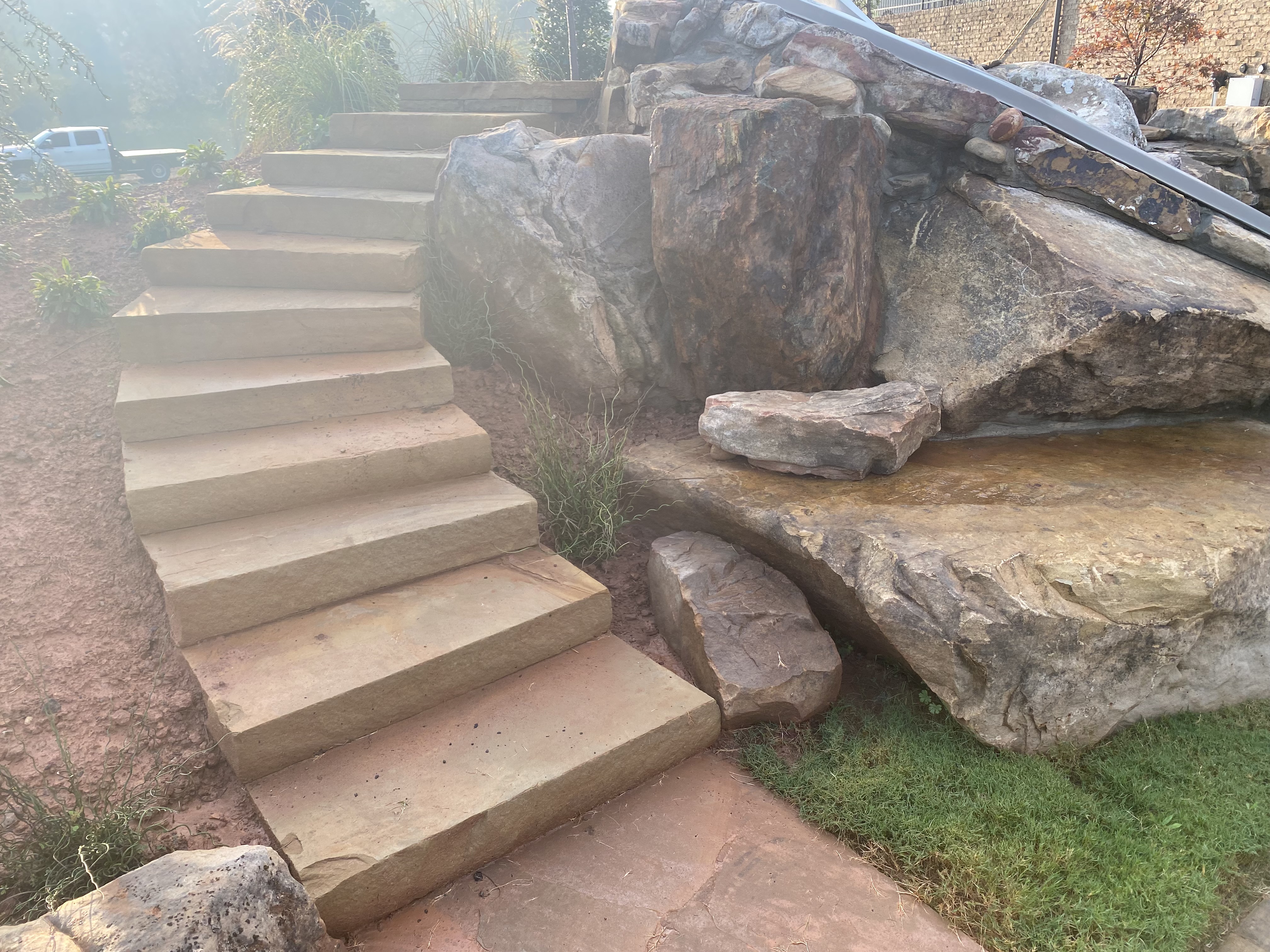 Stone steps next to boulder water feature in North Atlanta, GA