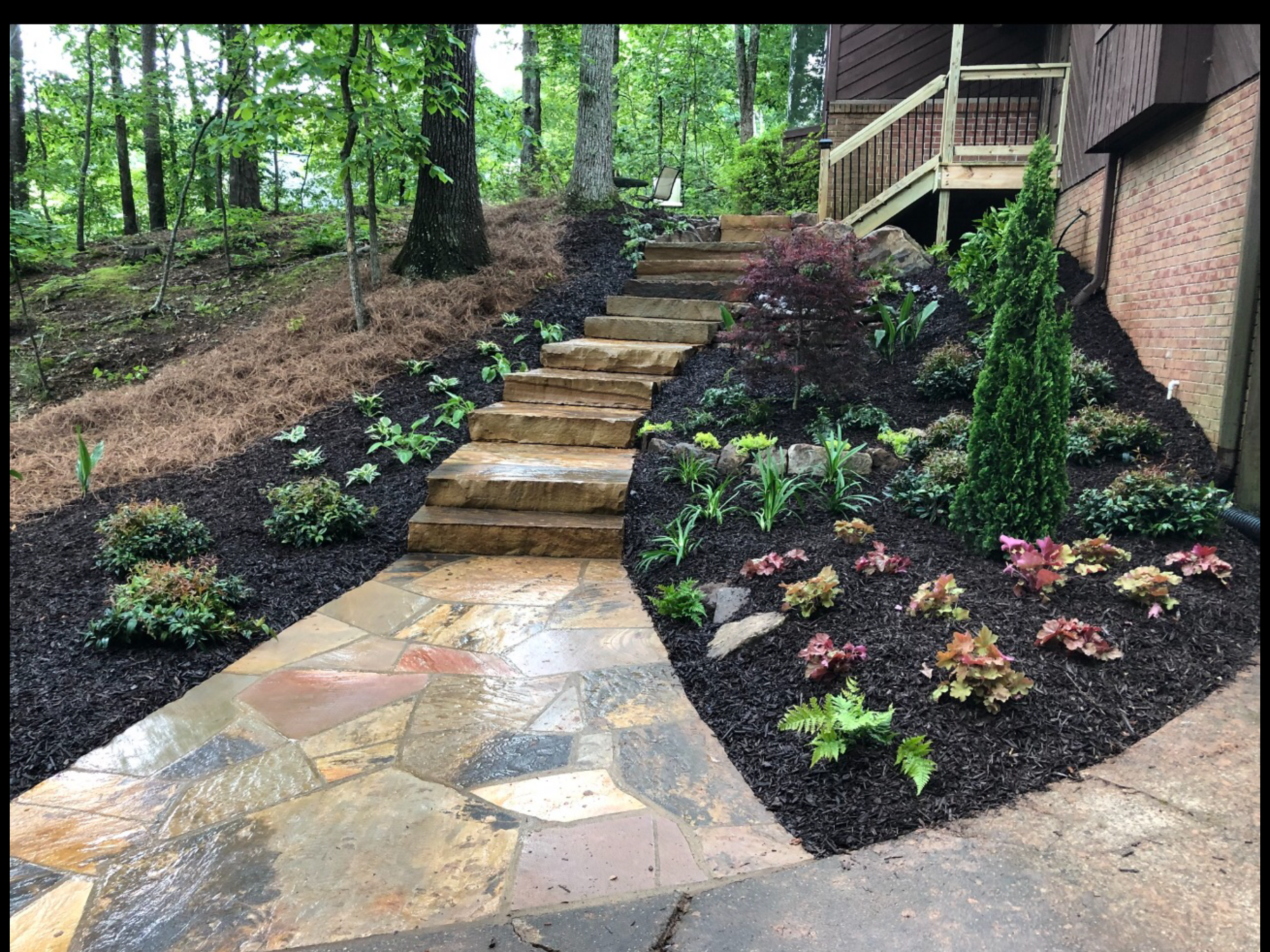 Flagstone walkway with stone steps and plantings in North Atlanta, GA