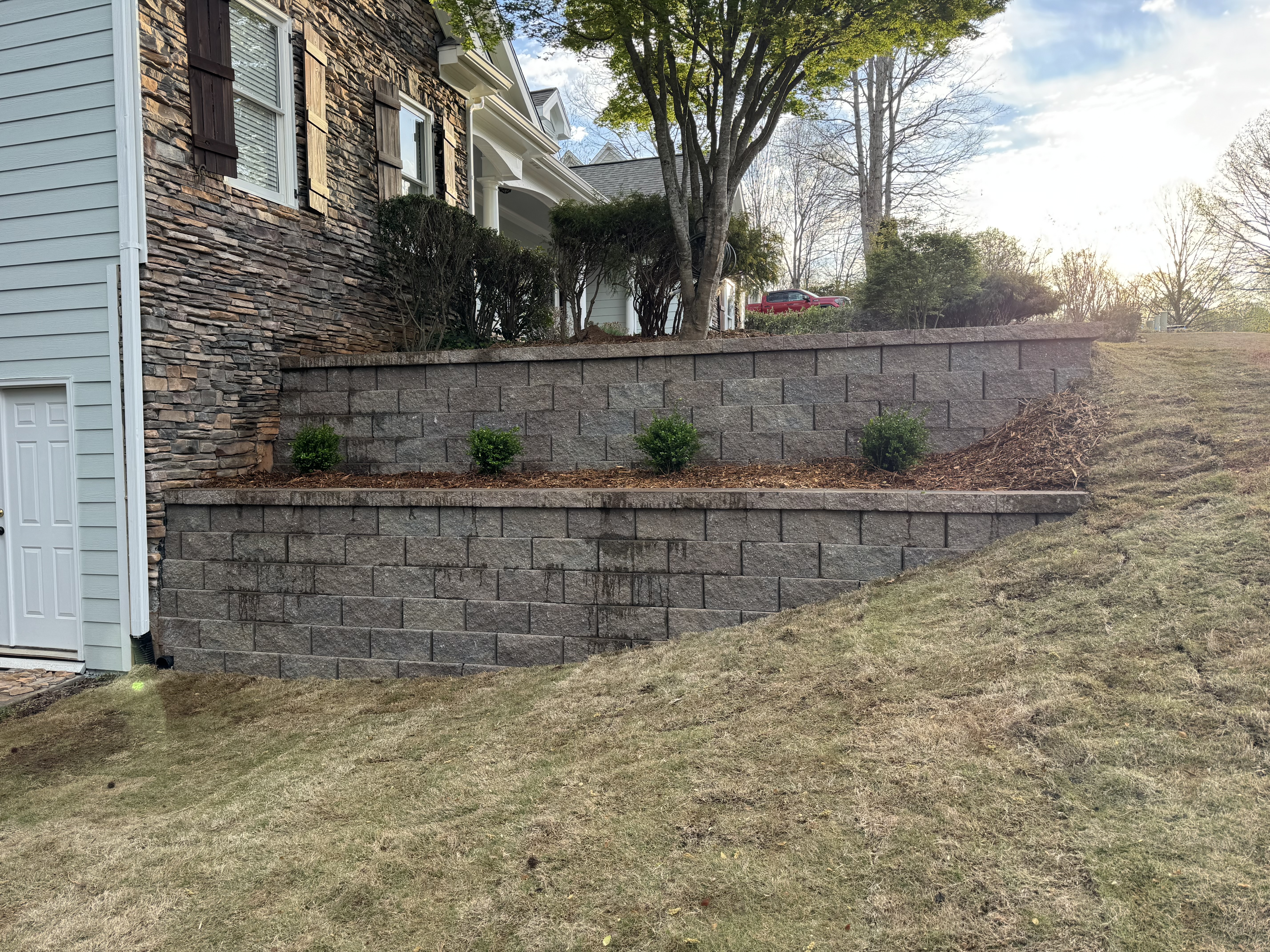 Block retaining wall along side of house in North Atlanta, GA